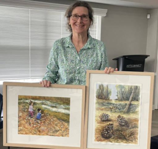 Sue Kinsella with her paintings